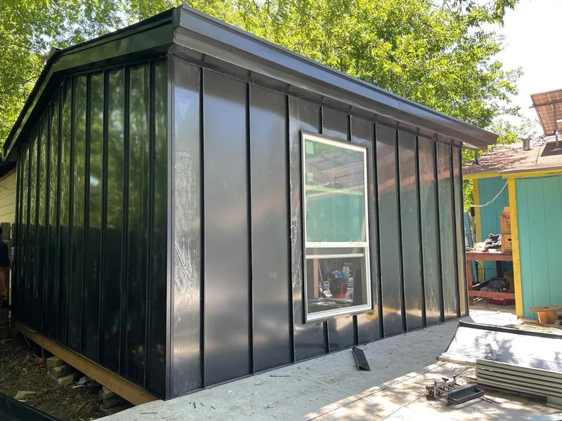 Black standing seam metal wall panels for Roof Inspection in San Carlos Park