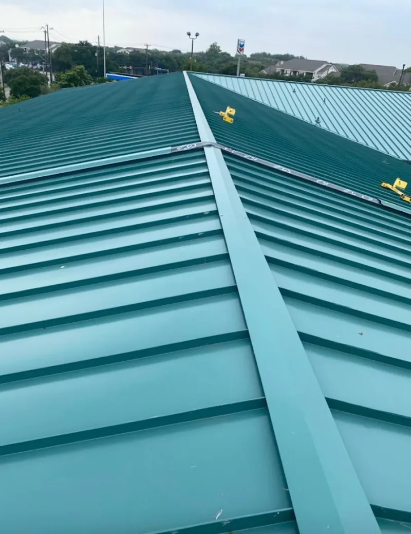 Green commercial metal roof ridge and valley for Metal Roof Repair in San Carlos Park