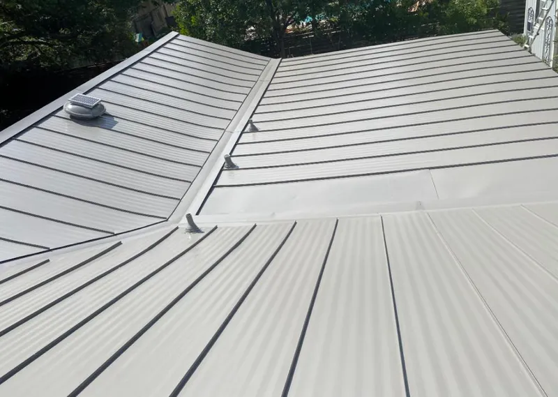 Solar attic fan installed on a metal roof for Roof Ventilation in San Carlos Park